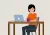 vrouw zit aan bureau achter haar laptop